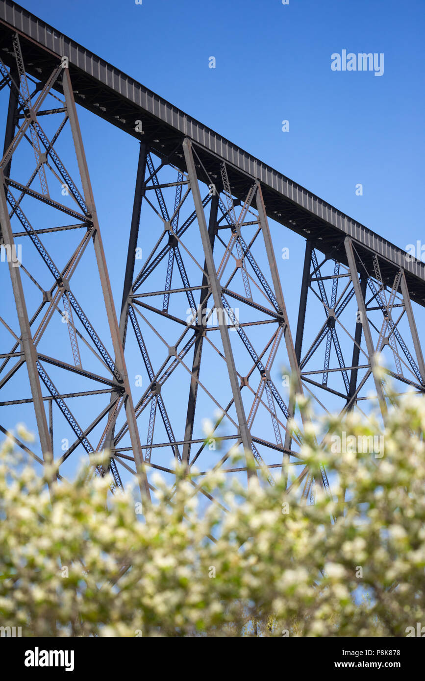 The High Level Bridge in Lethbridge, Alberta, as seen during spring from within the Old Man River valley. Stock Photo