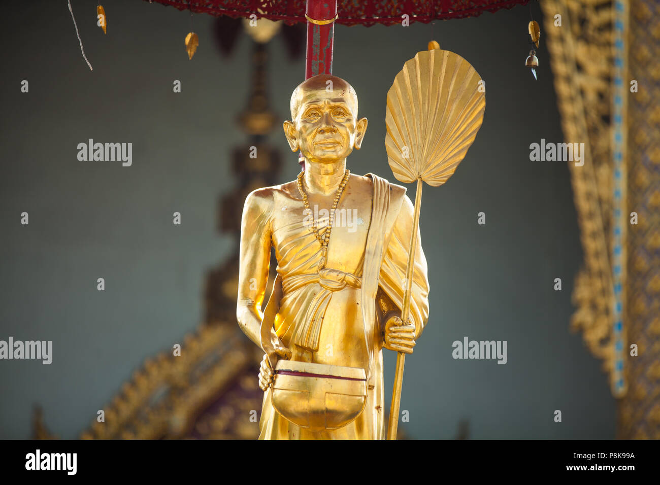 Golden buddhist monk statue hi-res stock photography and images - Alamy