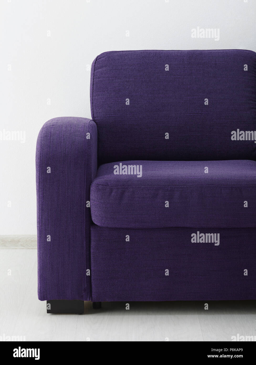 Sofa in white room. Close-up Stock Photo