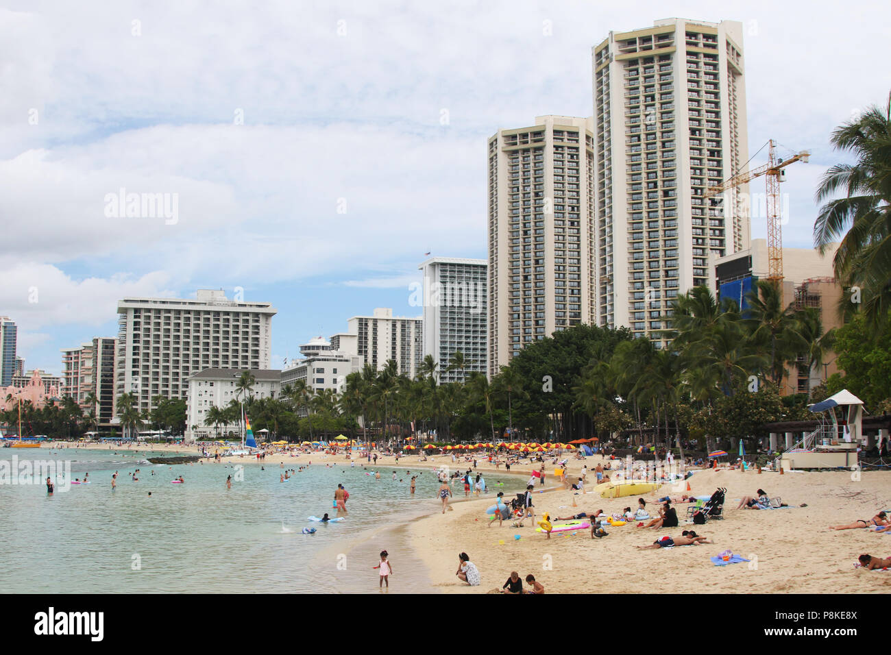 Tourists on the beach. Waikiki Beach, Waikiki, Honolulu, Oahu Island