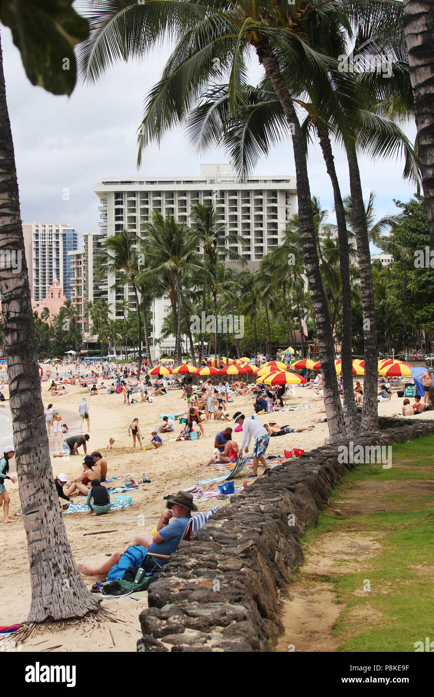 Tourists on the beach. Waikiki Beach, Waikiki, Honolulu, Oahu Island
