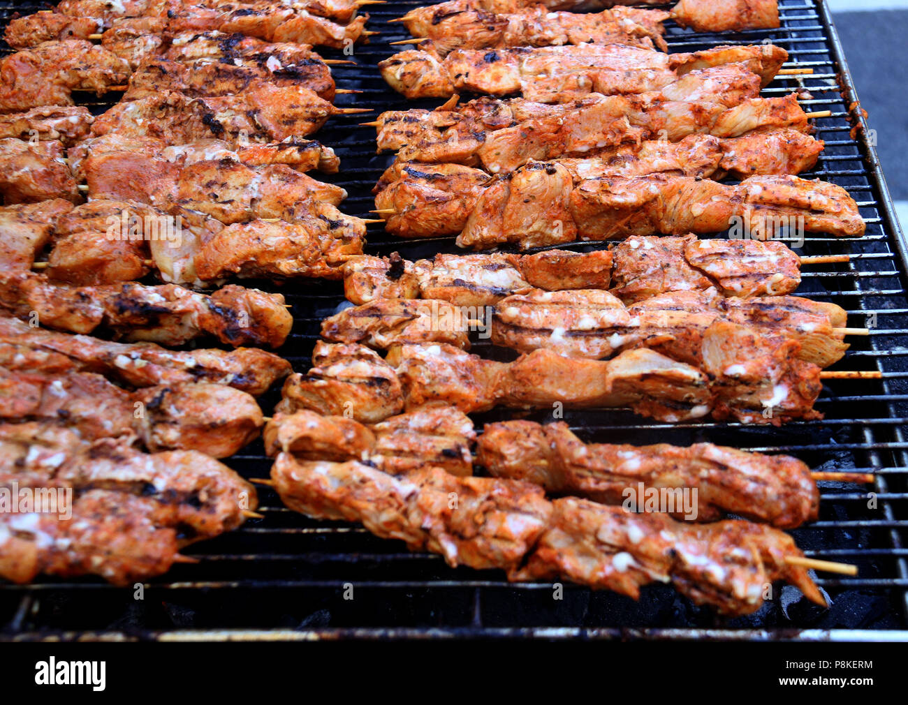 Chicken Kebabs cooking on a grill Stock Photo Alamy