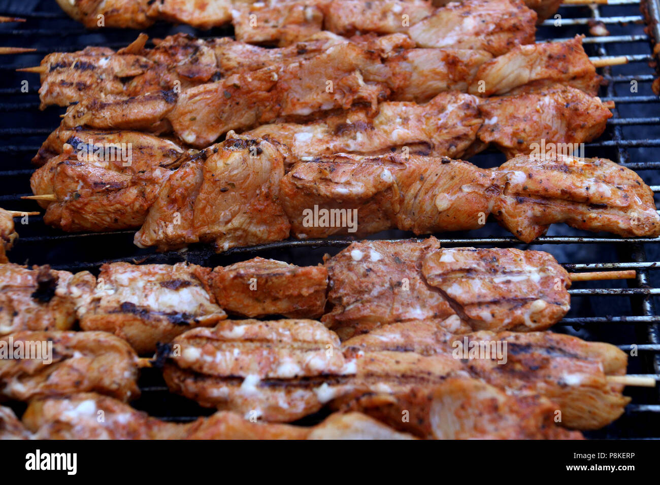 Chicken Kebabs cooking on a grill Stock Photo Alamy