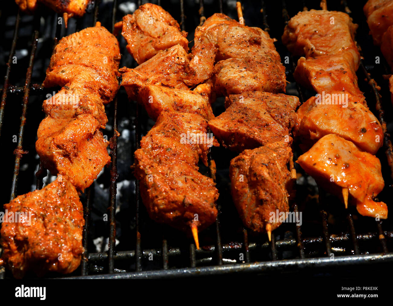 Chicken Kebabs cooking on a grill Stock Photo Alamy
