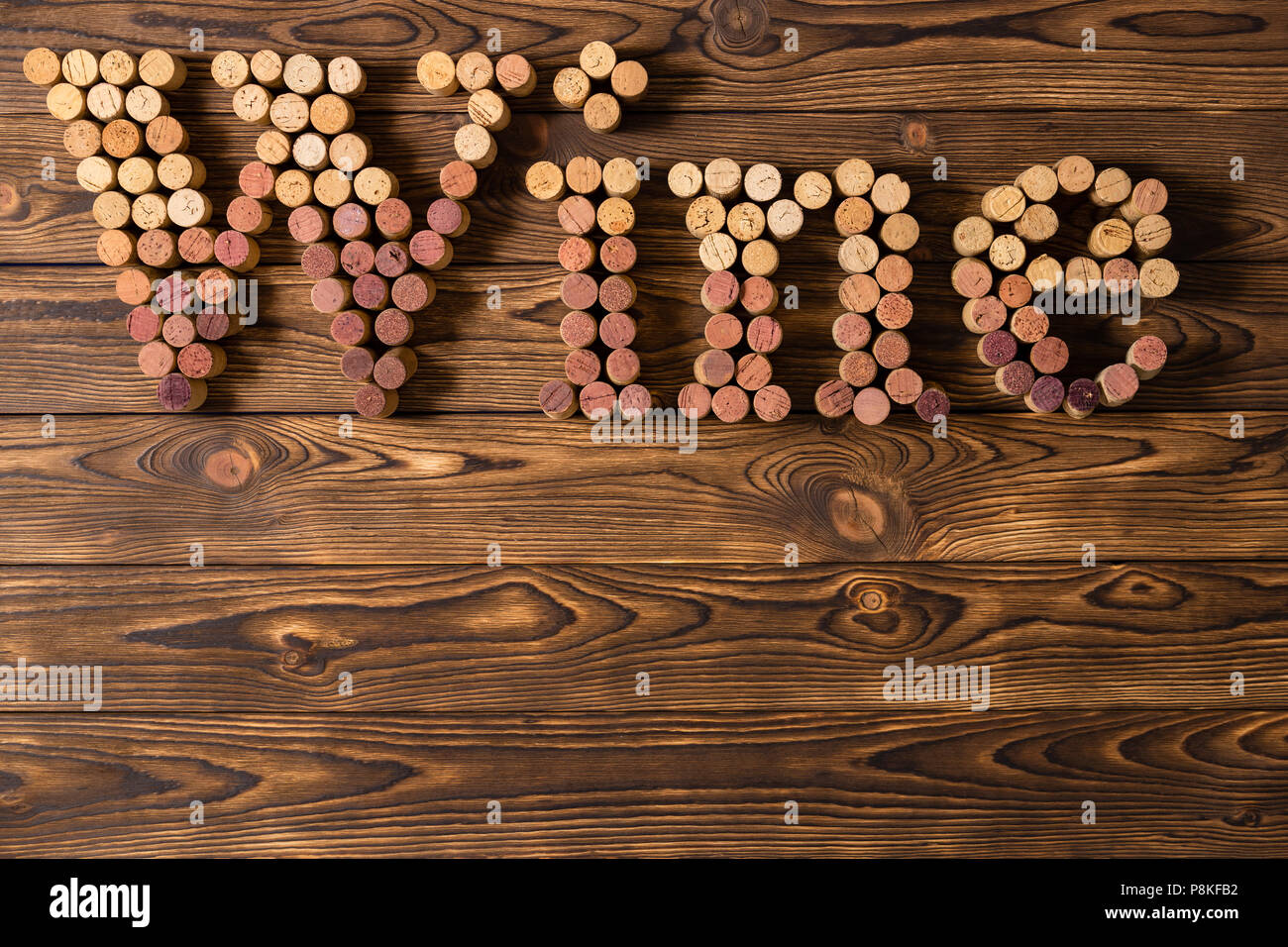 Decorative Used Red And White Wine Bottle Corks Spelling The Word