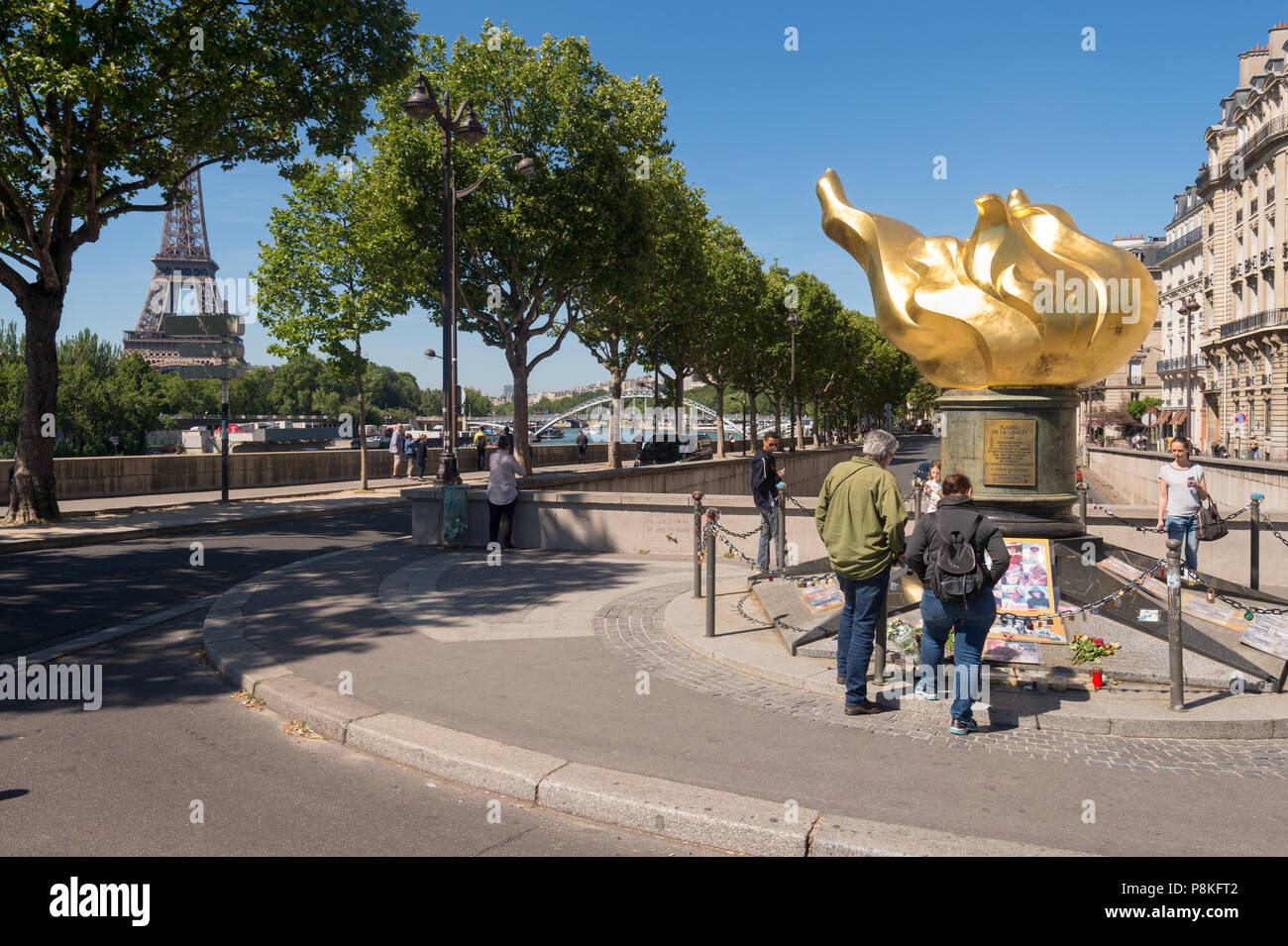 Paris, France - 23 June 2018: Tourists gather in front of the flame of freedom, an unofficial memorial for Diana, princess of Wales. Stock Photo