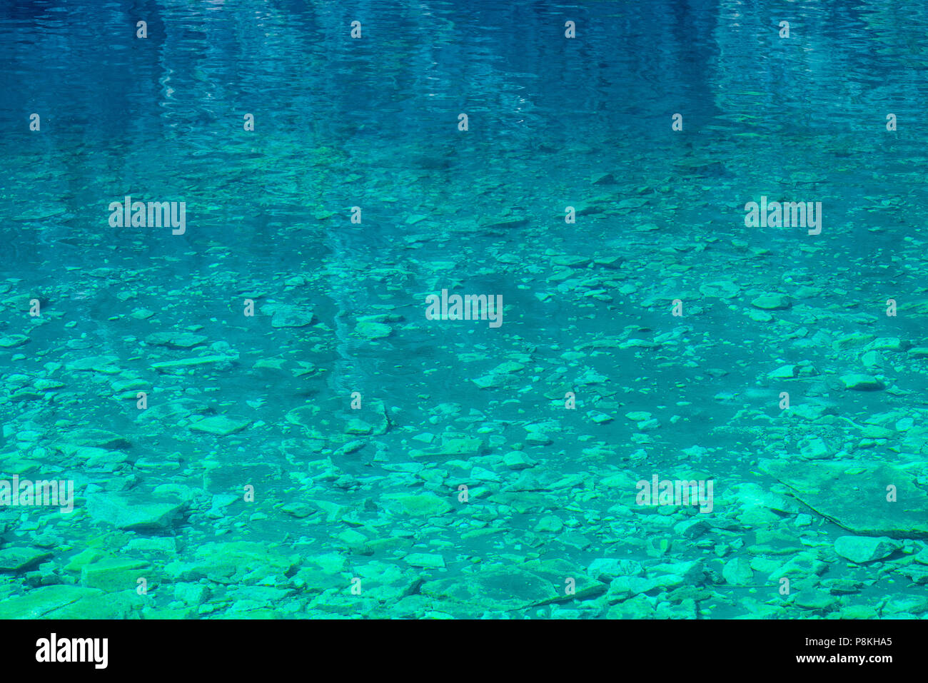 transparent water of a mountain lake, a view of the rocky bottom Stock ...