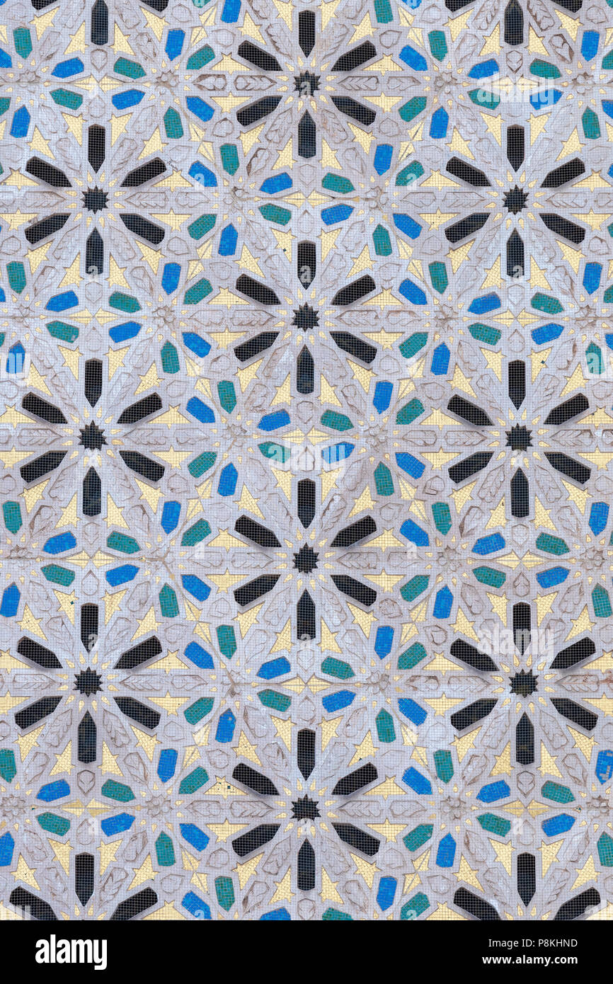 Detail of the patterning on the exterior walls of Hassan II Mosque in Casablanca, Morocco.  Wall is covered in an anti-bird netting Stock Photo