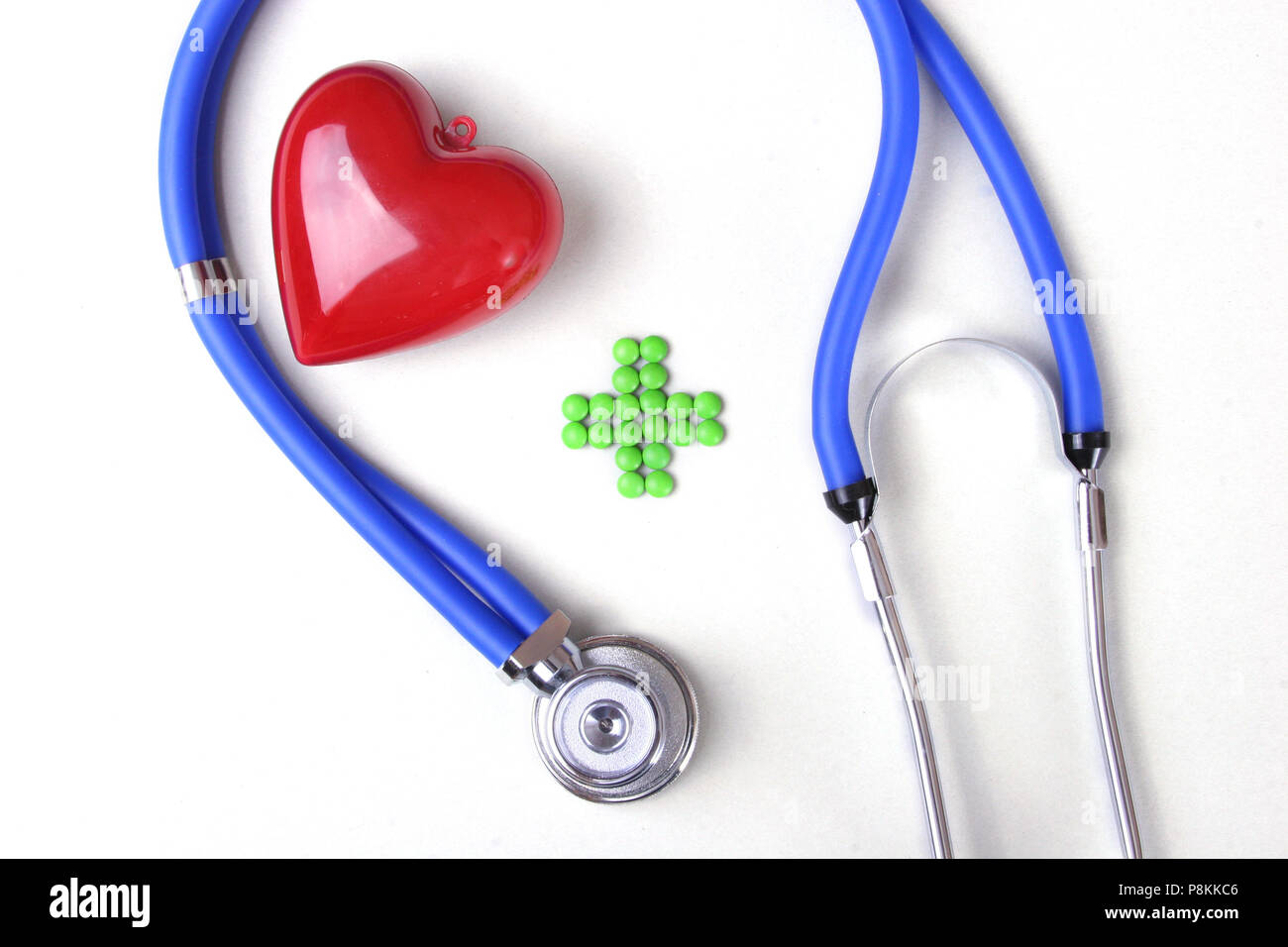 Red heart and a stethoscope on white background Stock Photo - Alamy