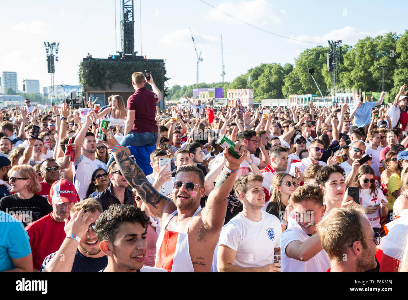 London, UK. 11th July, 2018. 30,000 England fans watch the Lightning Seeds before a public screening of the FIFA 2018 World Cup semi-final between England and Croatia in Hyde Park, the largest such screening of a football match since 1996. The event was organised by the Mayor of London and Government in conjunction with the Royal Parks, the Football Association and other agencies. The match provides England with the chance to reach their first World Cup final since 1966, the only occasion they have won the tournament. Credit: Mark Kerrison/Alamy Live News Stock Photo