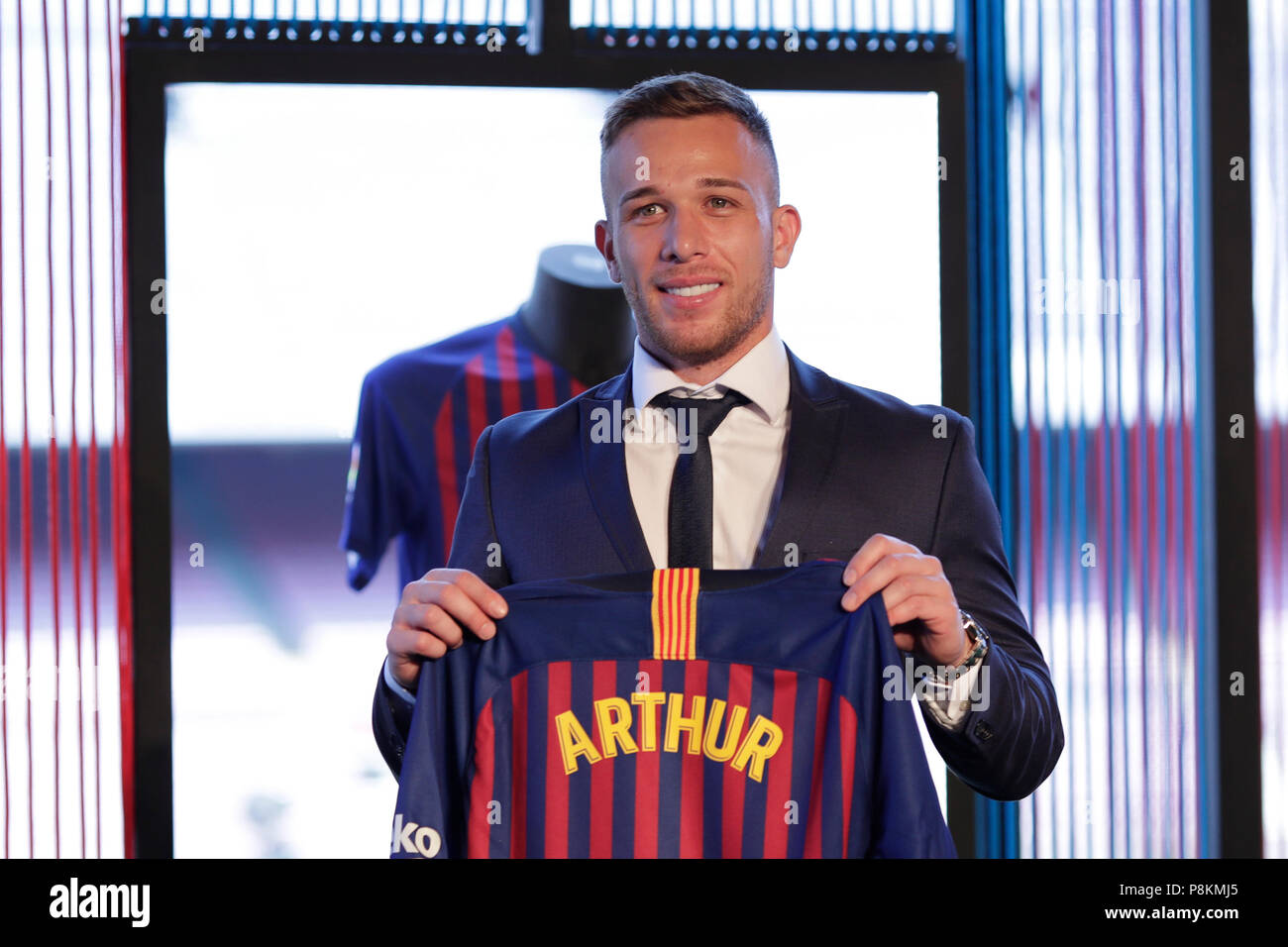 Camp Nou, Barcelona, Spain. 12th July, 2018. FC Barcelona press conference to unveil new signing, Arthur Melo poses with his new shirt Credit: Action Plus Sports/Alamy Live News Stock Photo