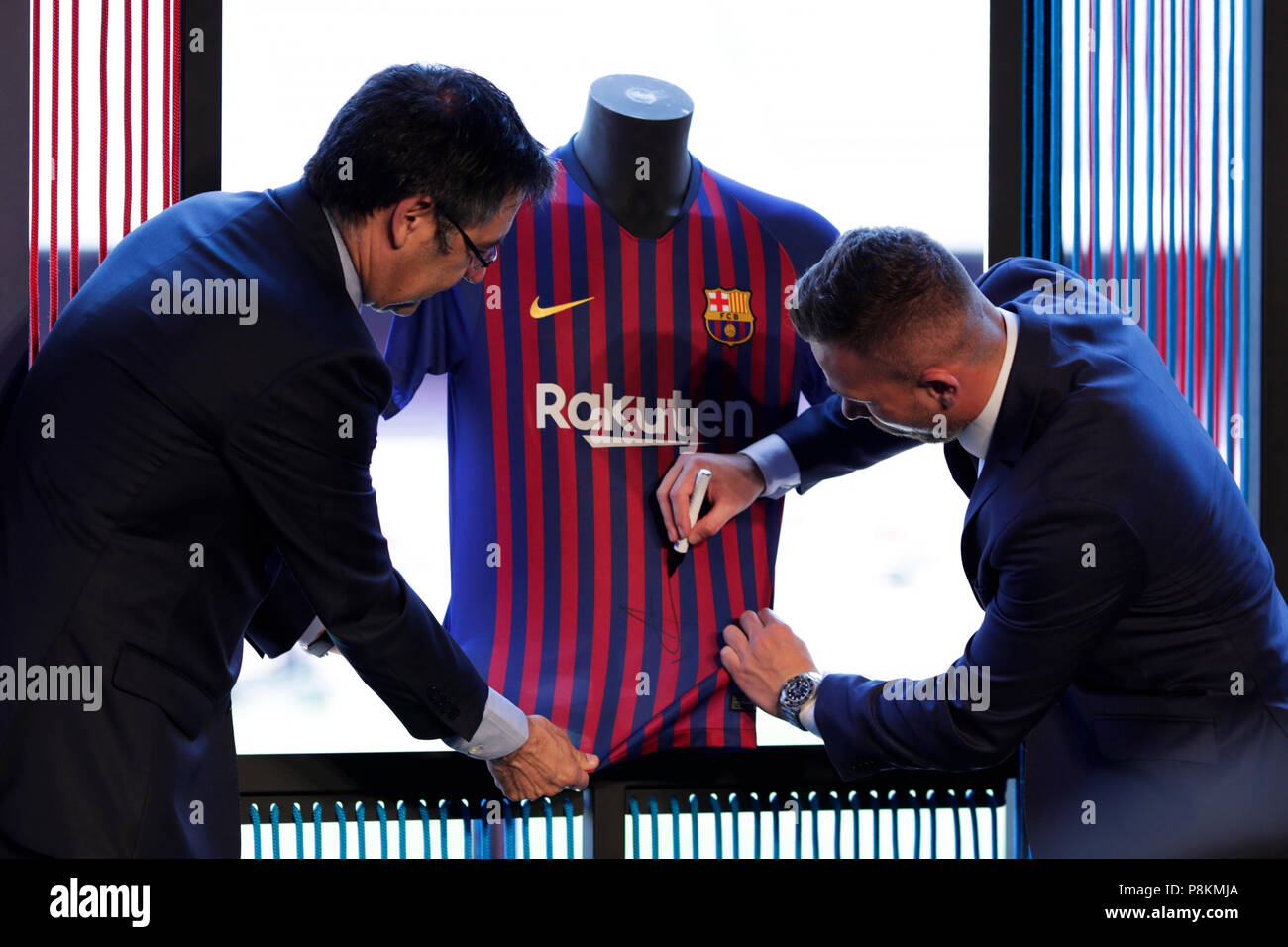 Camp Nou, Barcelona, Spain. 12th July, 2018. FC Barcelona press conference to unveil new signing, Arthur Melo signs his new shirt Credit: Action Plus Sports/Alamy Live News Stock Photo