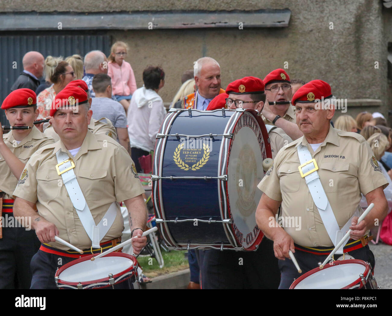 Donaghcloney, County Down, Northern Ireland.12 July 2018. Orange order parade on 12th July in Northern Ireland. The Twelfth of July is marked by Orange Order parades across Northern Ireland. The largest parade in County Down this year was at Donaghcloney. Thousands turned out to see the parade through the village. The parades across Northern Ireland mark the victory of William of Orange over James at the Battle of the Boyne in 1690. Thousands turned out to watch the colourful parade at Donaghcloney. Credit: CAZIMB/Alamy Live News. Stock Photo