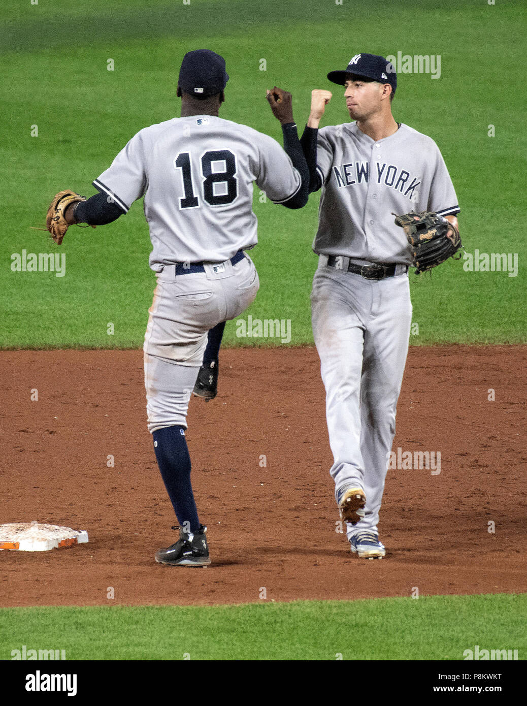 Baltimore, United States Of America. 11th July, 2018. New York Yankees shortstop Didi Gregorius (18) and New York Yankees second baseman Tyler Wade (12) celebrate following their team's 90 - 0 win over the Baltimore Orioles at Oriole Park at Camden Yards in Baltimore, MD on Wednesday, July 11, 2018. The Yankees won the game 9 - 0. Credit: Ron Sachs/CNP (RESTRICTION: NO New York or New Jersey Newspapers or newspapers within a 75 mile radius of New York City) | usage worldwide Credit: dpa/Alamy Live News Stock Photo