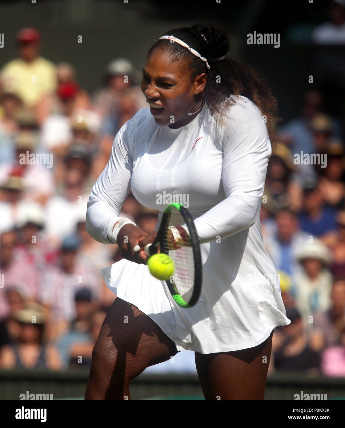 London, England - July 12, 2018. Wimbledon Tennis: Serena Williams in  cation during her victory over Germany's Julia Georges during their  semi-final match today at Wimbledon. Williams won in straight sets to