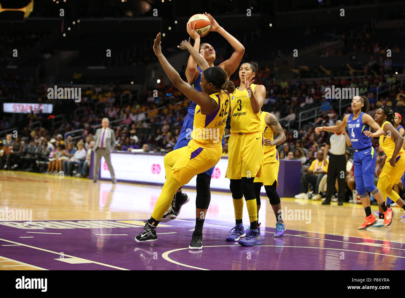 Dallas Wings center Elizabeth Cambage 8 running over Los Angeles