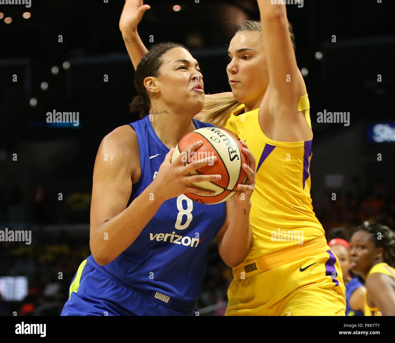 Dallas Wings center Elizabeth Cambage 8 guarded Los Angeles Sparks