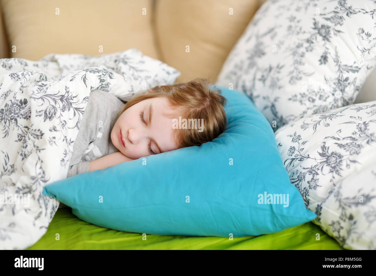 Adorable little girl sleeping in a bed Stock Photo - Alamy
