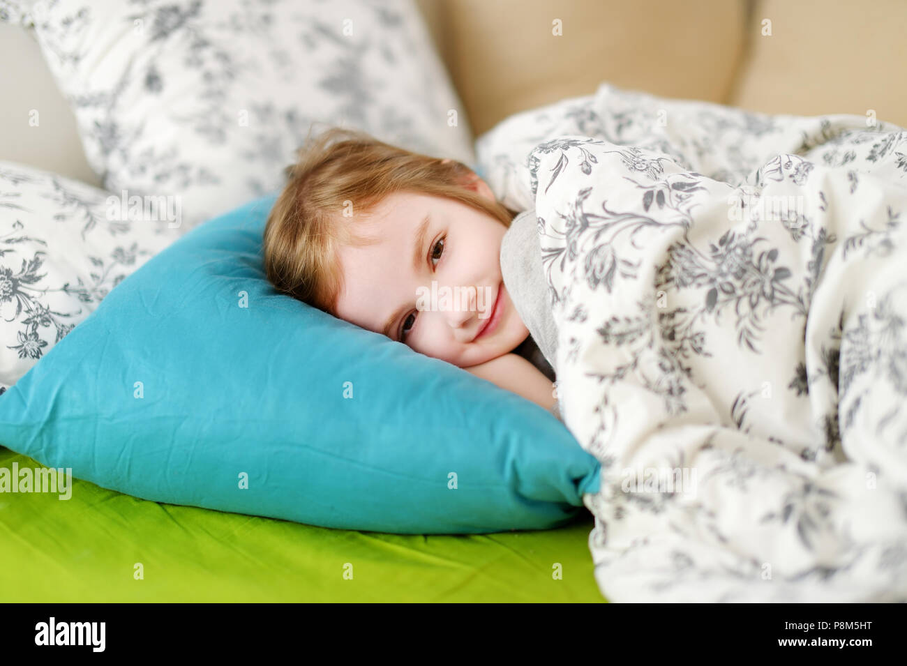 Adorable little girl sleeping in a bed Stock Photo - Alamy