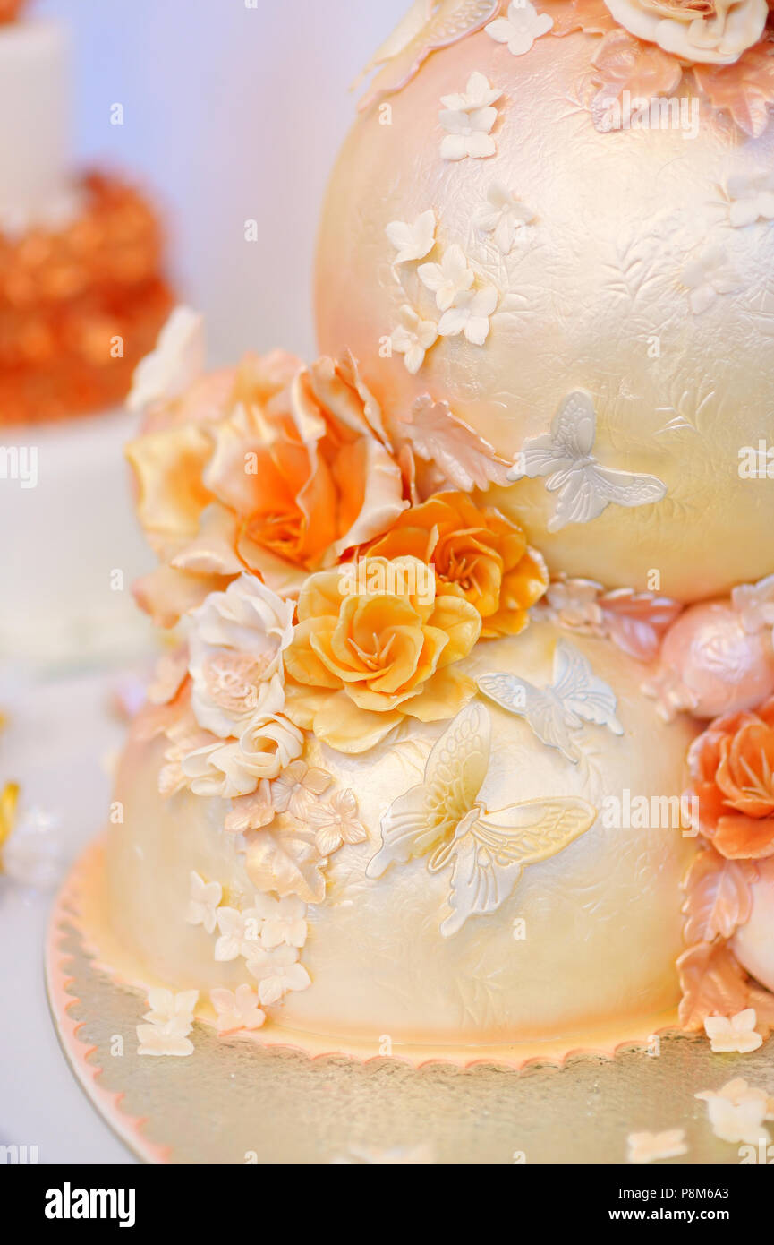 Fancy Delicious White And Yellow Wedding Cake Decorated With
