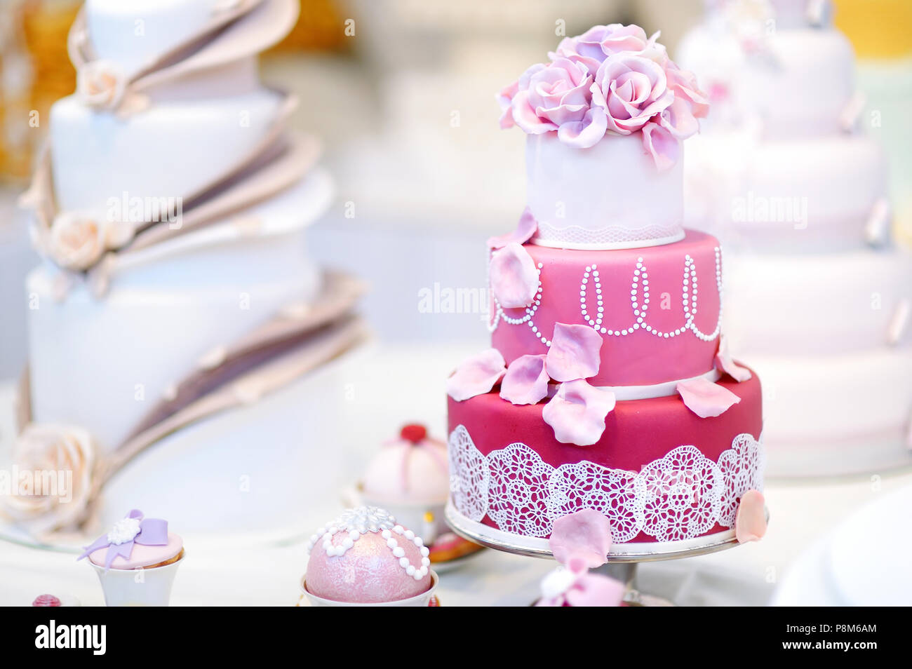 White wedding cake decorated with pink sugar flowers Stock Photo - Alamy