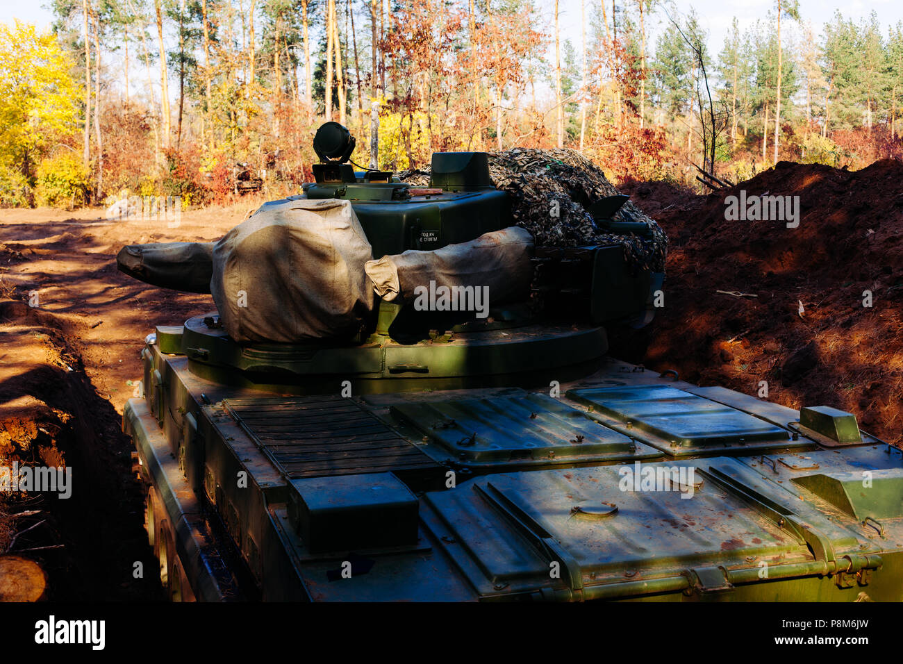 real battle tanks disguised in the trenches Donbass Ukraine Stock Photo