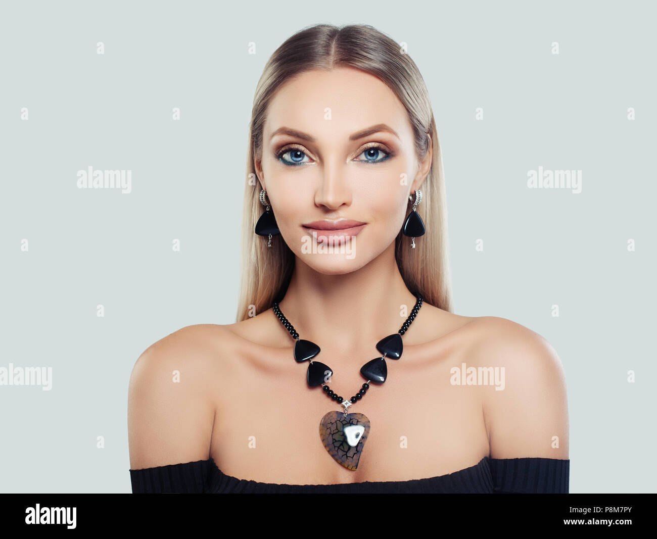 Stylish Woman With Blonde Hair Makeup And Jewelry Silver