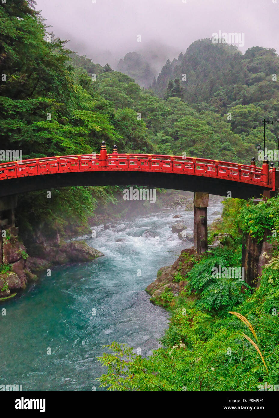 Spectacular View Of The Shinkyo Bridge Over The Mountain Gorge At Nikko Tochigi Prefecture Japan Misty Mountains In Background And Torrent Beneath Stock Photo Alamy
