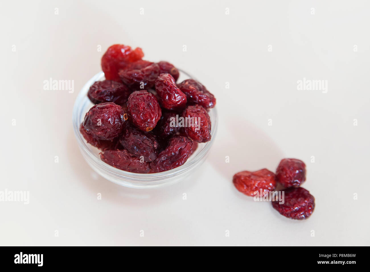 Dried sweetened cranberries in a glass bowl Stock Photo Alamy