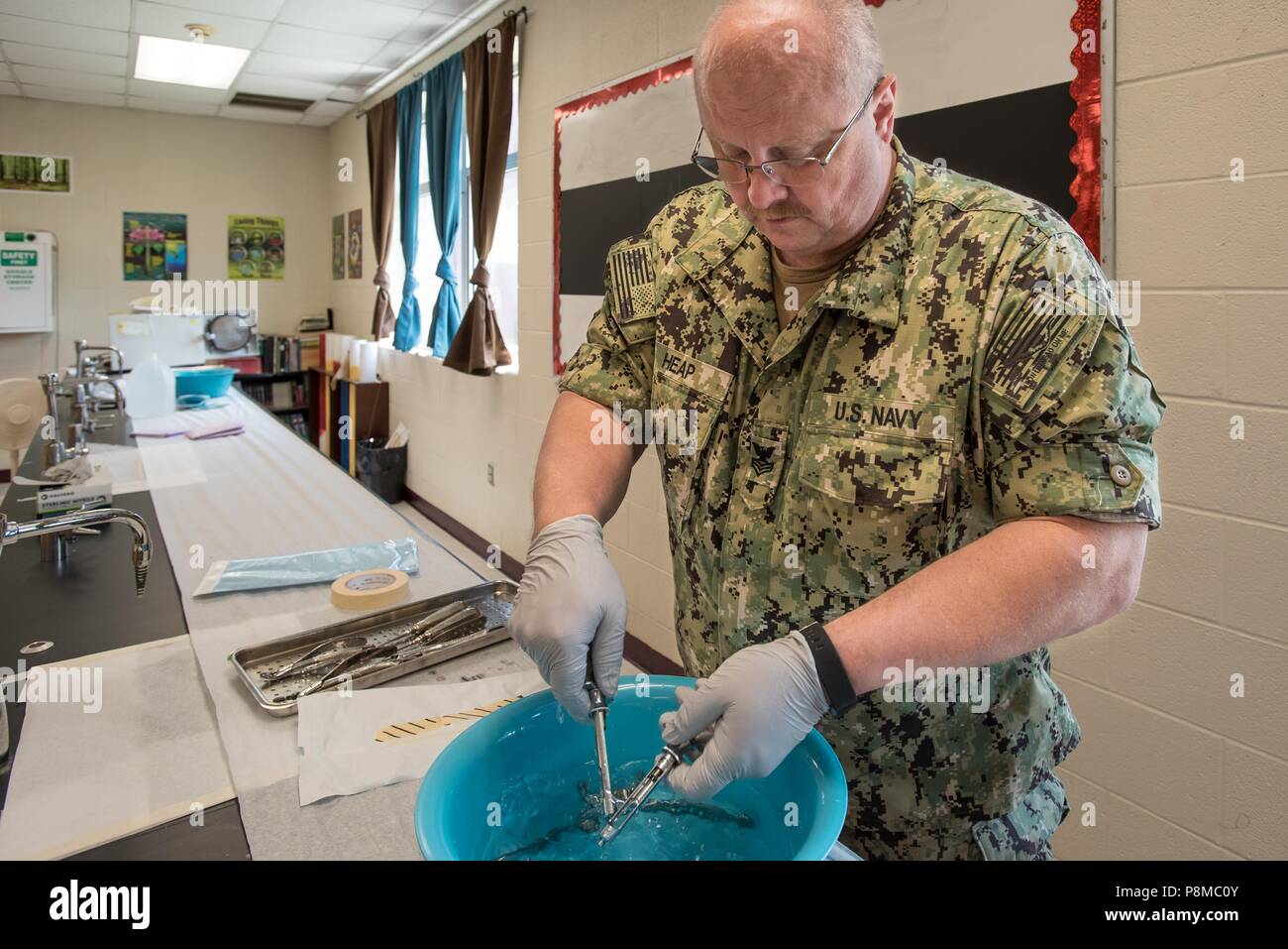U.S. Navy HM1 Billy Joe Heap, a corpsman from Expeditionary Medical Facility Dallas, sterilizes dental instruments at a health-care clinic at Owsley County High School in Booneville, Ky. June 24, 2018, June 24, 2018. The clinic is one of four that comprised Operation Bobcat, a 10-day mission to provide military medical troops with crucial training in field operations and logistics while offering no-cost health care to the residents of Eastern Kentucky. The clinics, which operated from June 15-24, offered non-emergent medical care, sports physicals, dental cleanings, fillings and extractions, e Stock Photo