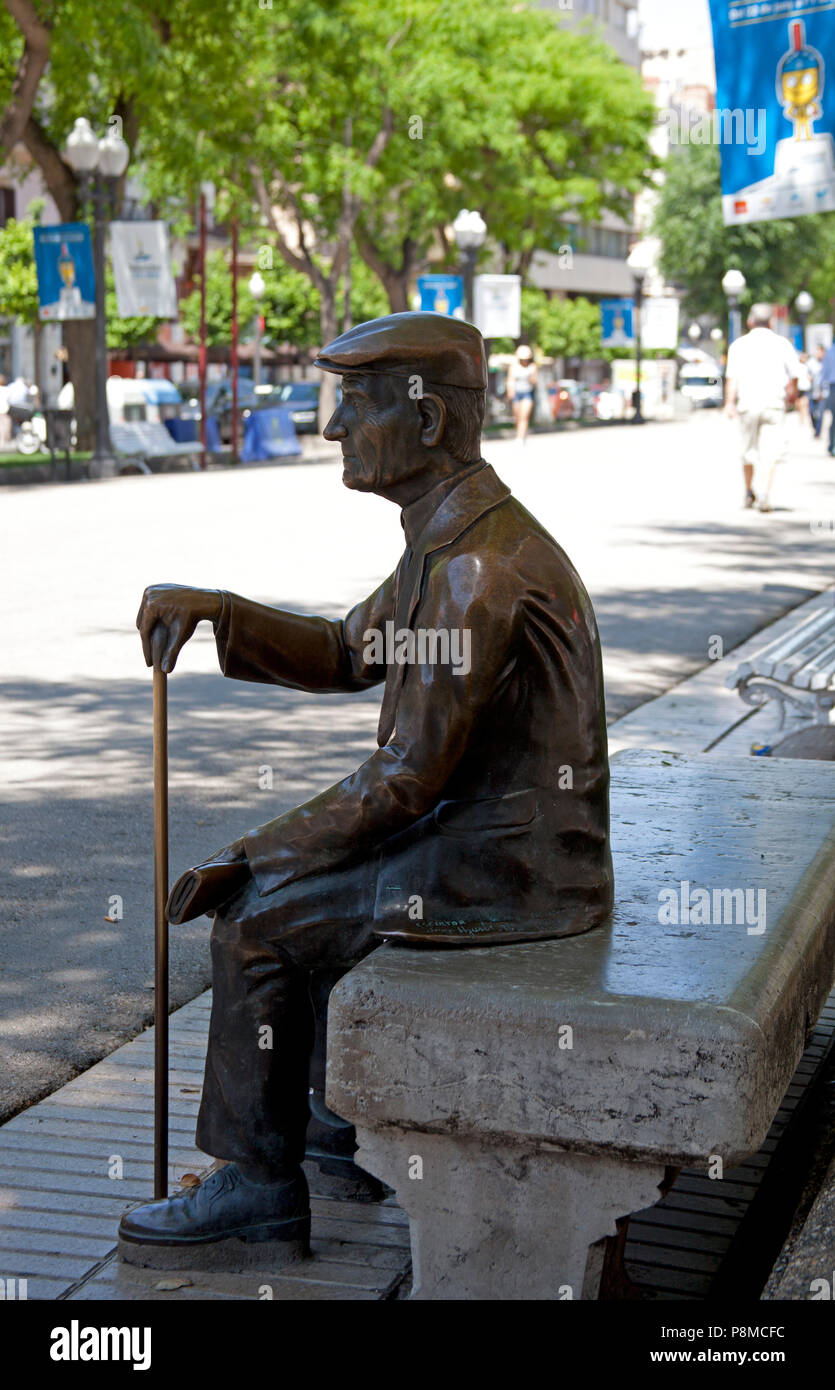 Tarragona, statue of older man sitting on bench, Spain,Europe Stock Photo