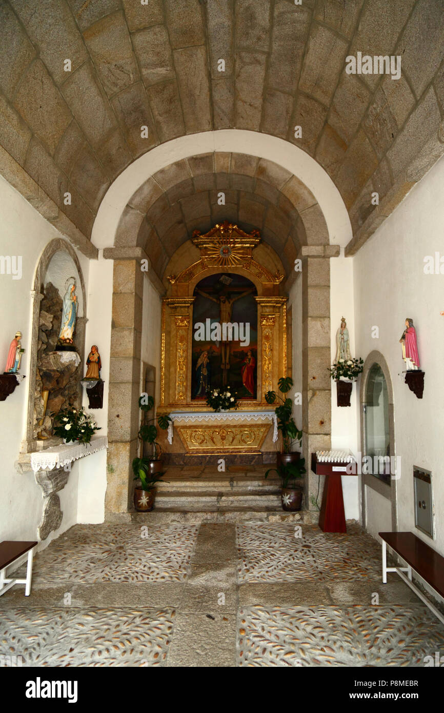 Virgen of Lourdes statue and interior of church of Monte do Calvario, Vila Praia de Ancora, Minho Province, northern Portugal Stock Photo