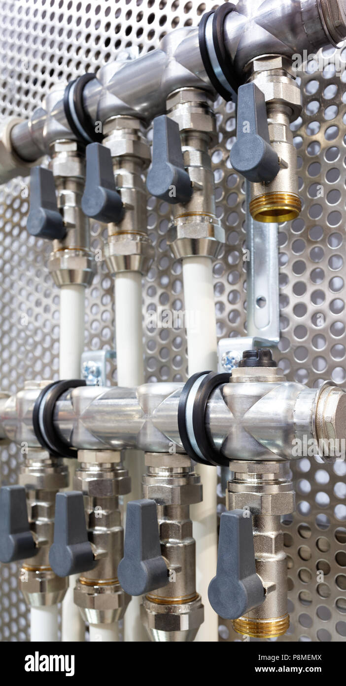 Compact brass distributor with gray valves Stock Photo Alamy