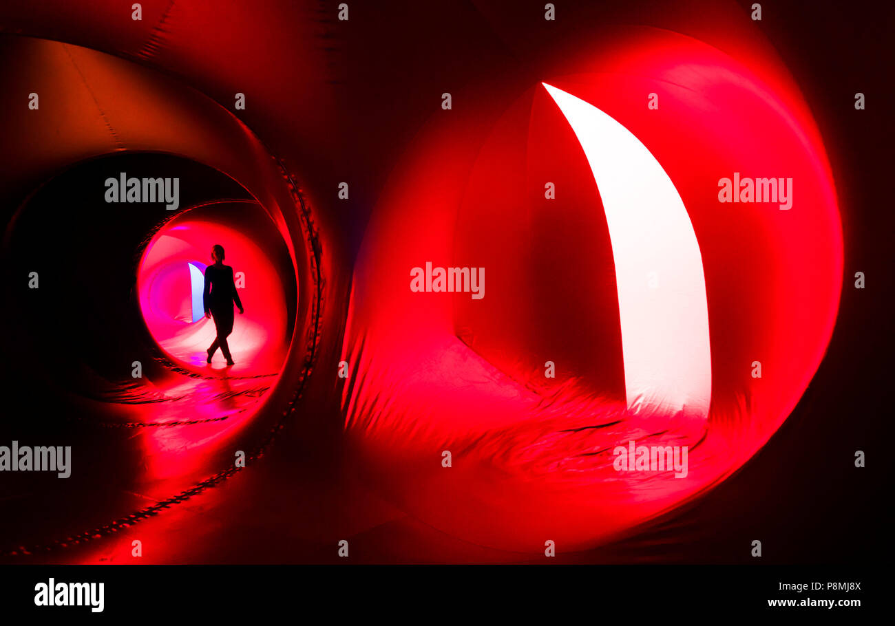 A person explores The Luminarium, a giant interactive art installation, forming part of the Harrogate International Festivals in Yorkshire. Stock Photo
