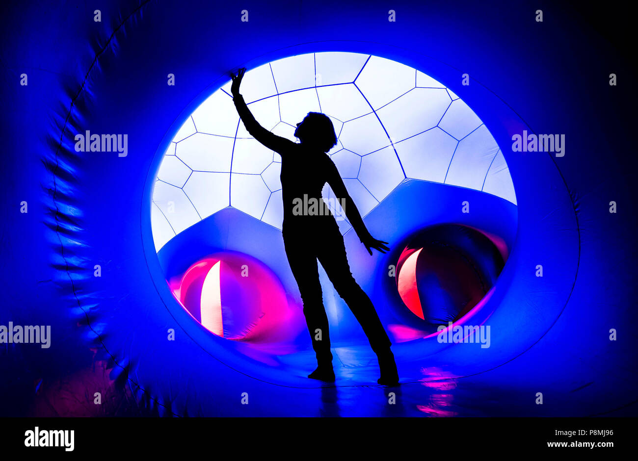 A person explores The Luminarium, a giant interactive art installation, forming part of the Harrogate International Festivals in Yorkshire. Stock Photo