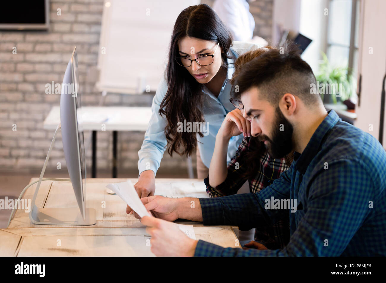Young architects working on project in office Stock Photo