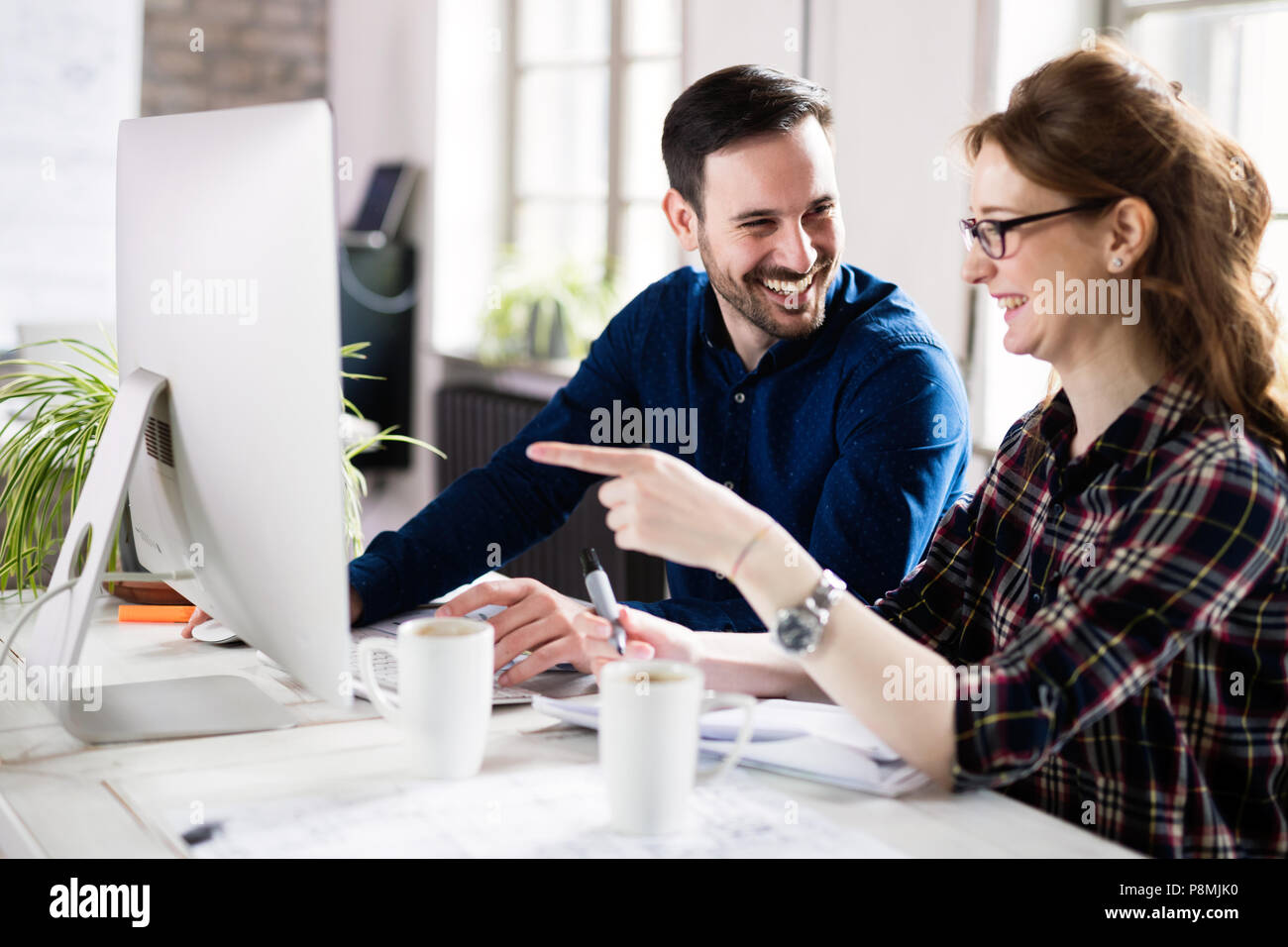 Young architects working on project in office Stock Photo
