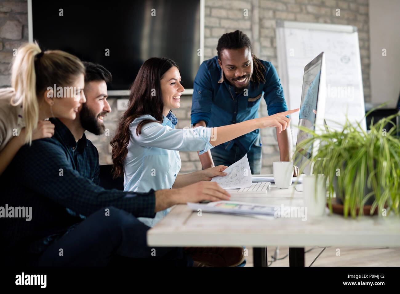 Young architects working on project in office Stock Photo