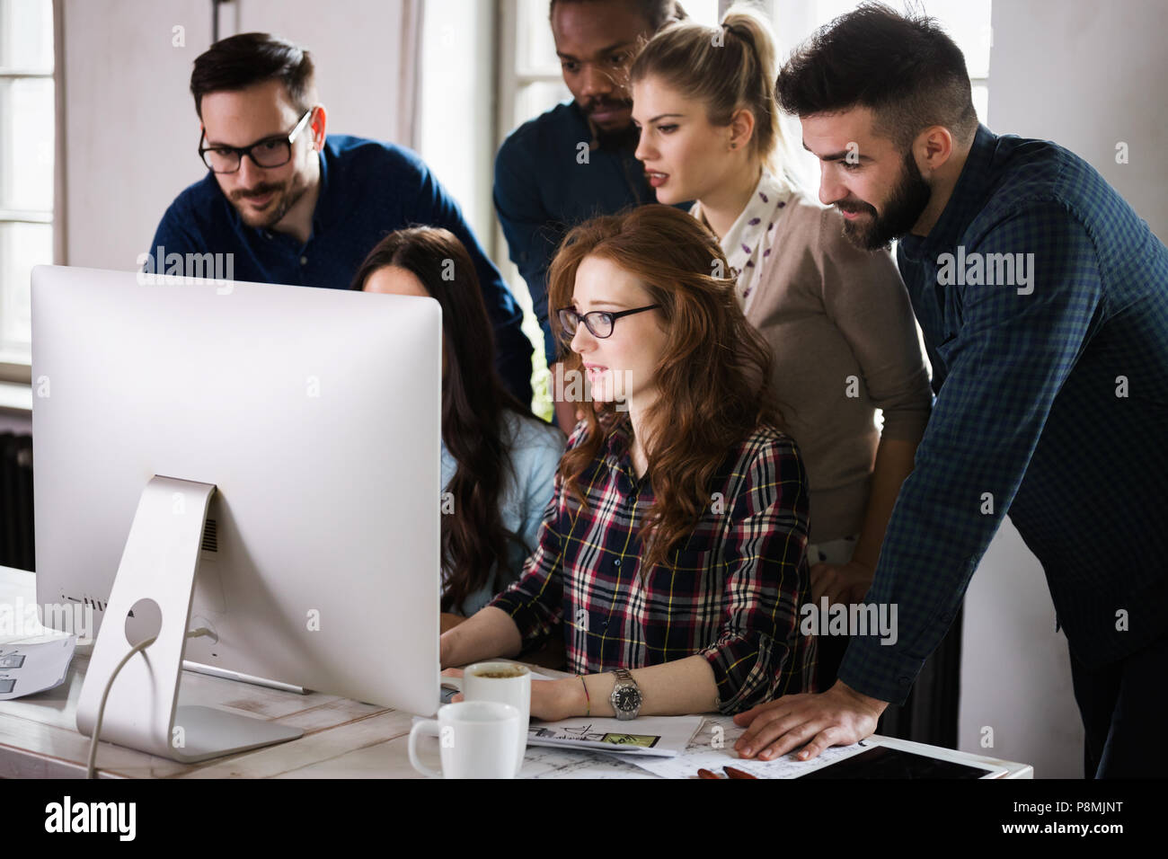 Young architects working on project in office Stock Photo