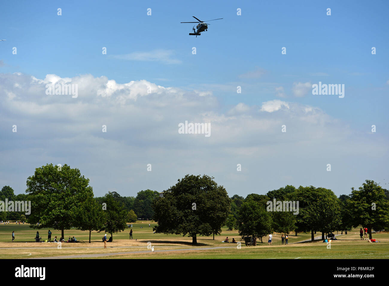 A helicopter of the US Marine Corps - one of two identical aircraft used by US President -flies nearthe residence of the US ambassador in London's Regent's Park, where US President Donald Trump is spending Wednesday night. Stock Photo