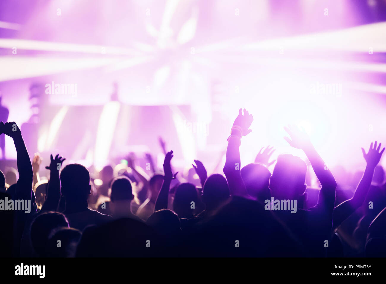 Cheering crowd with hands in air at music festival Stock Photo - Alamy