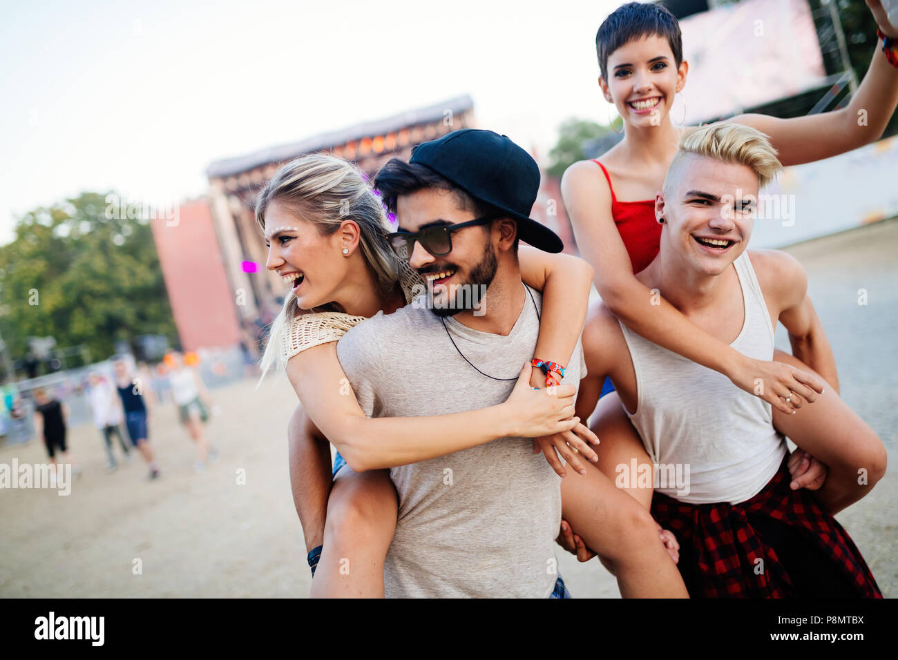Group of friends having fun time at music festival Stock Photo