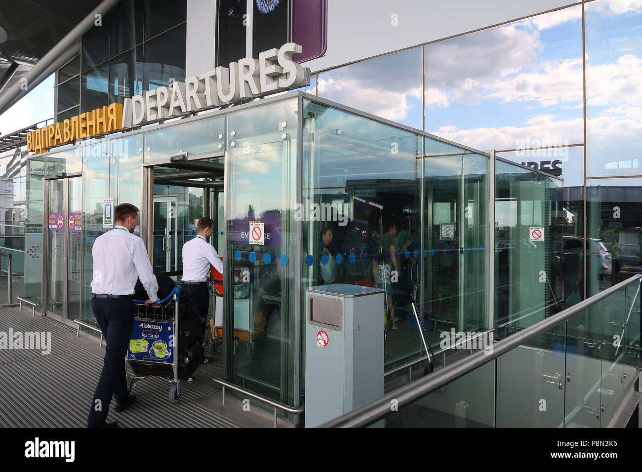 Porters carrying luggage of passengers in Boryspil International Airport east of Kiev capital of Ukraine Stock Photo