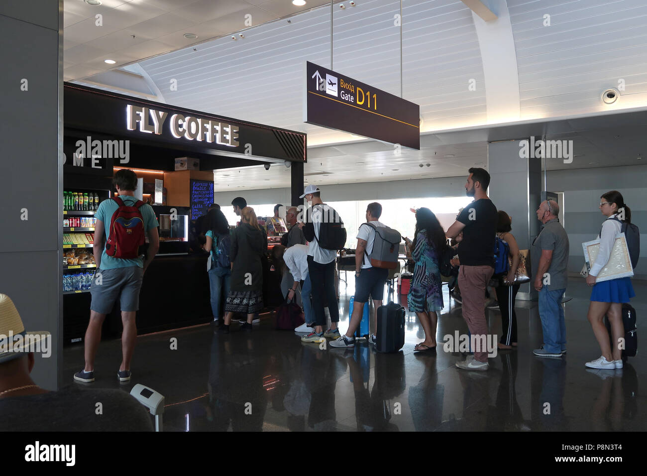 Travelers wait in line to buy coffee at Boryspil International Airport east of Kiev capital of Ukraine Stock Photo