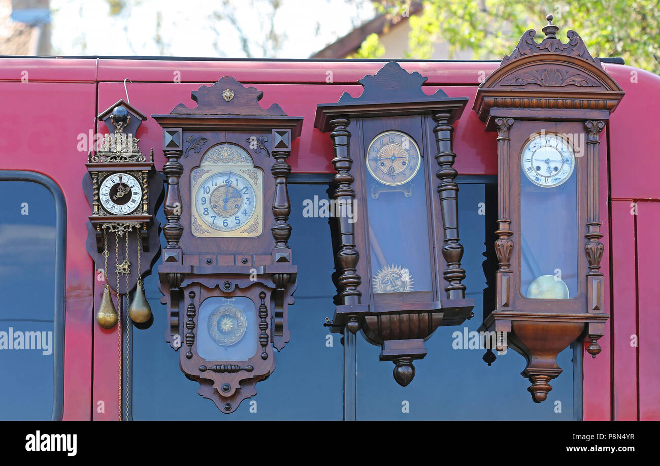 Four Used Pendulum Clocks at Flea Market Stock Photo Alamy