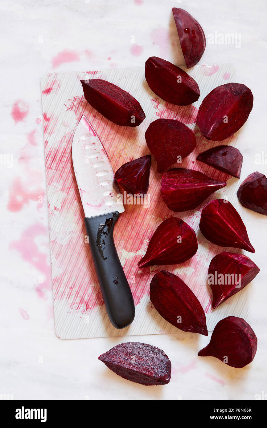 Beetroot on chopping board with kitchen knife Stock Photo