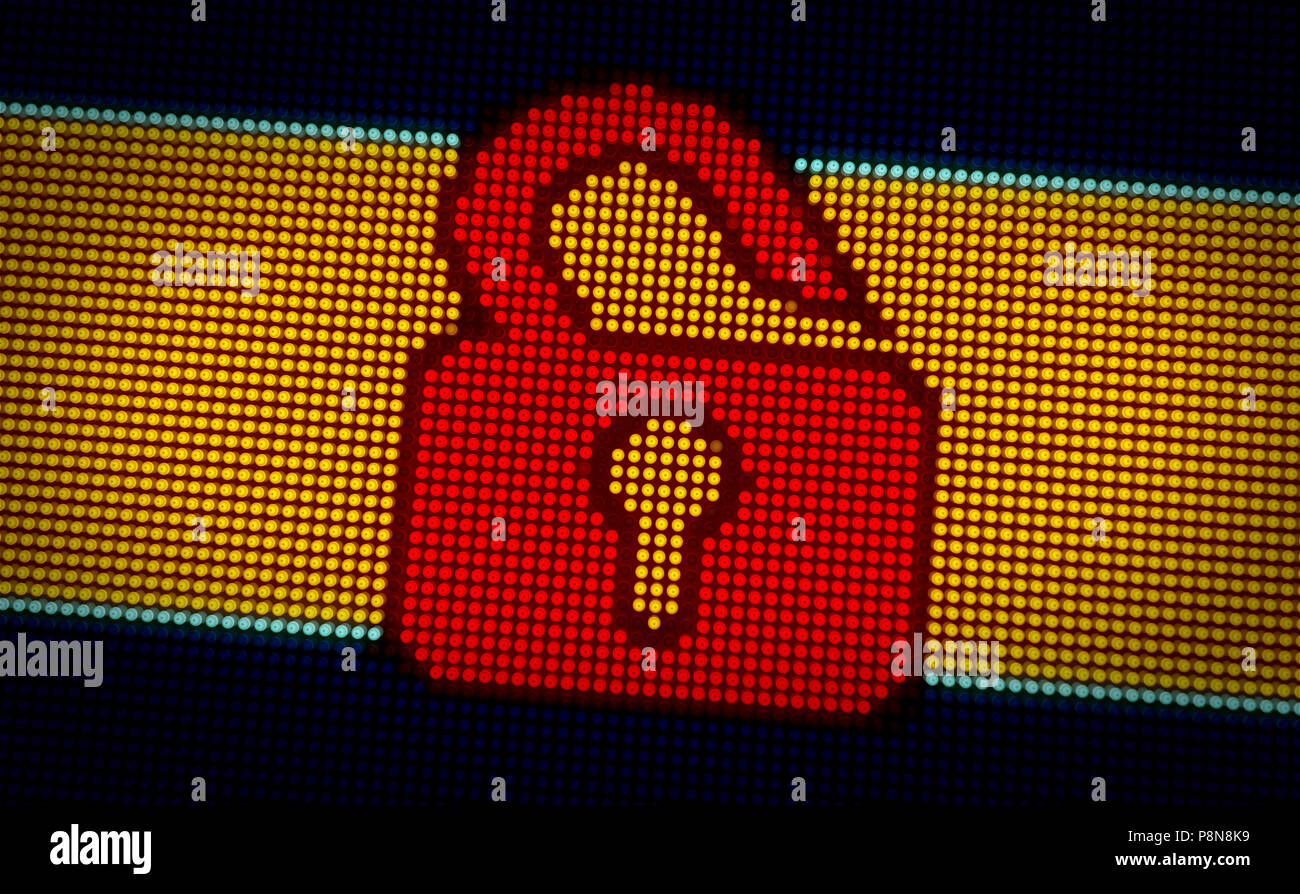 Computer padlock symbol on big LED display with large pixels. Bright ...