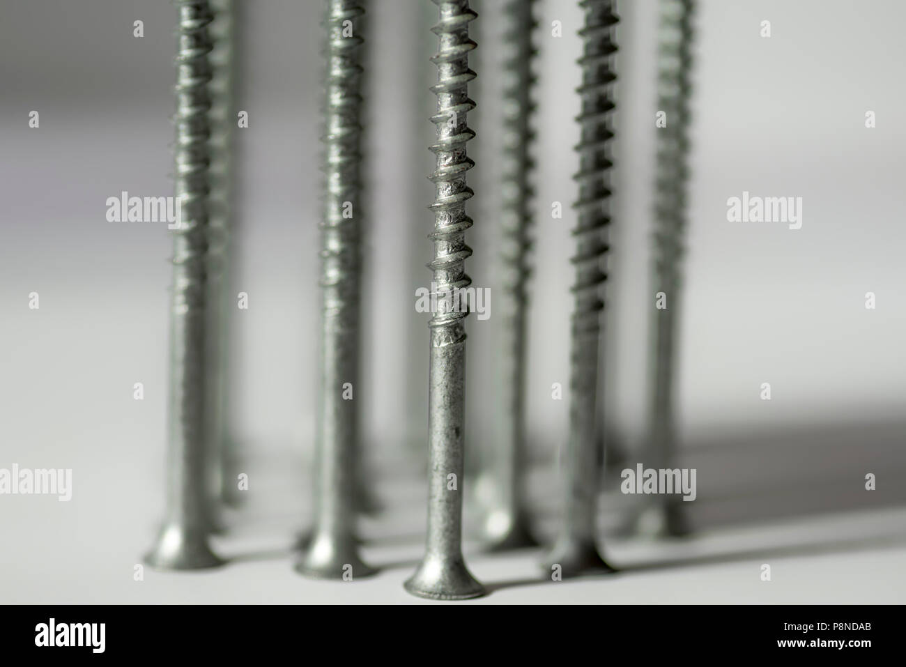 Close up of a group of metal screws. Stock Photo