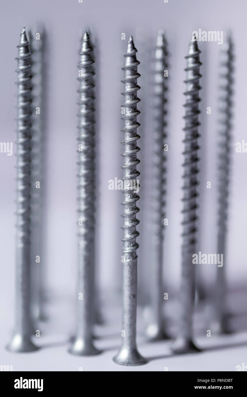 Close up of a group of metal screws. Stock Photo