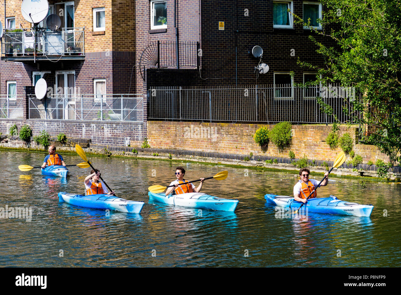 People kayaking on the Regents Canal, London, UK Stock Photo